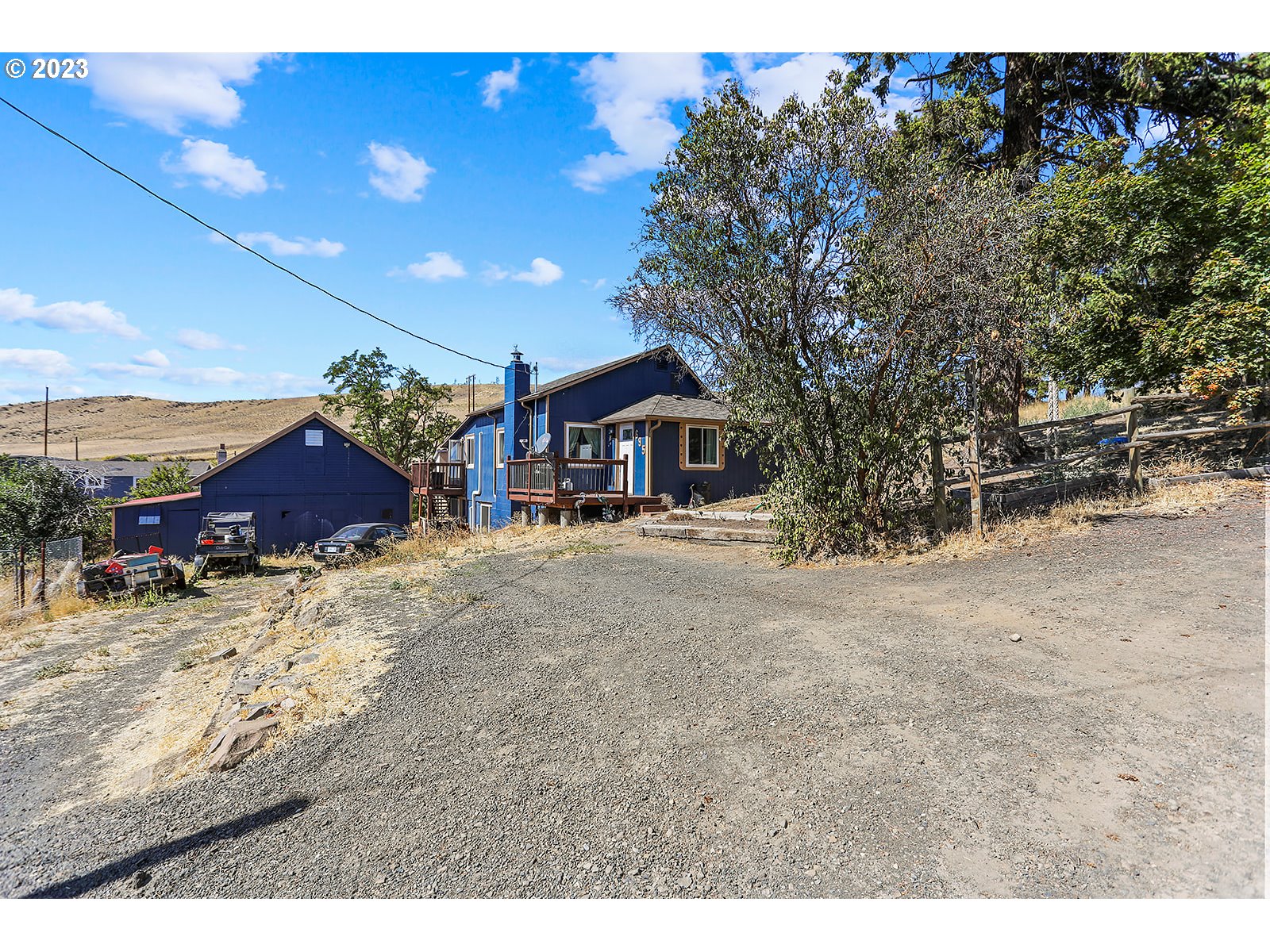 695 Main Street Dufur, OR 97021 - Photo 3 of 42 a front view of a house with a yard
