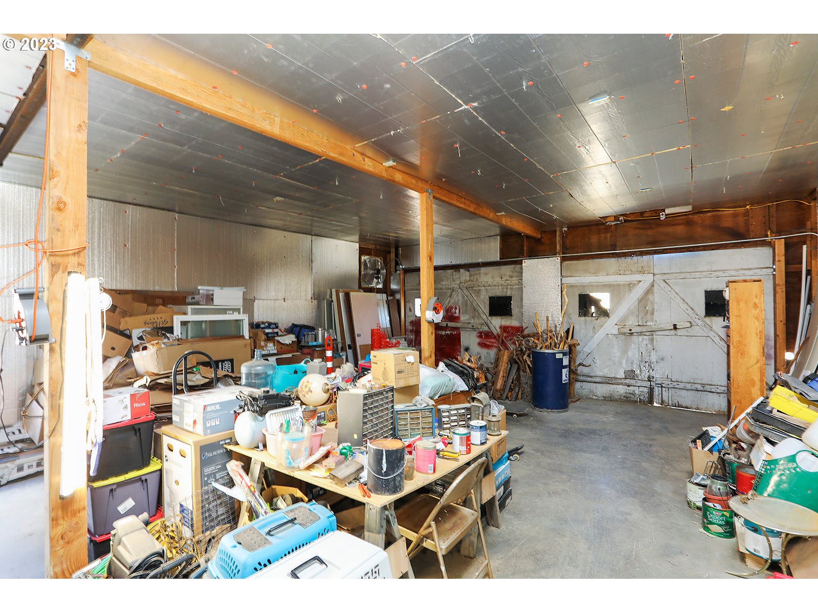 695 Main Street Dufur, OR 97021 - Photo 31 of 42 a room with lots of furniture and clutter