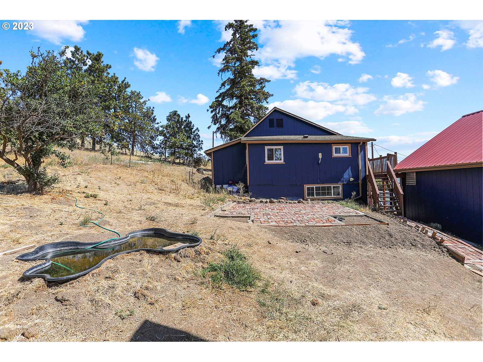 695 Main Street Dufur, OR 97021 - Photo 37 of 42 a view of a house with a yard