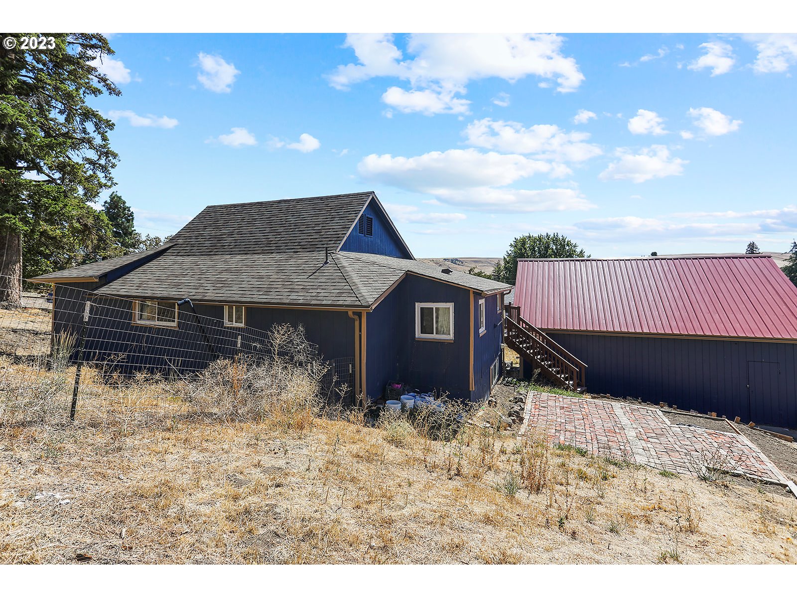 695 Main Street Dufur, OR 97021 - Photo 38 of 42 a view of a house with a yard