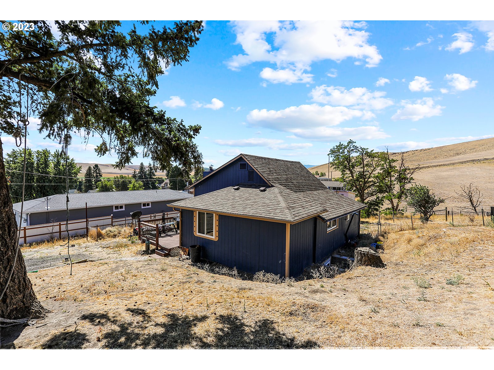 695 Main Street Dufur, OR 97021 - Photo 41 of 42 a view of a house with a yard
