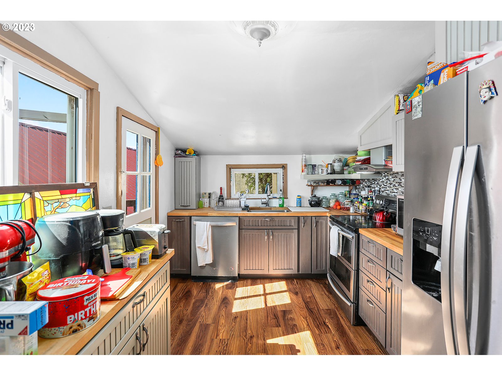 695 Main Street Dufur, OR 97021 - Photo 5 of 42 a kitchen that has a lot of cabinets a sink and appliances