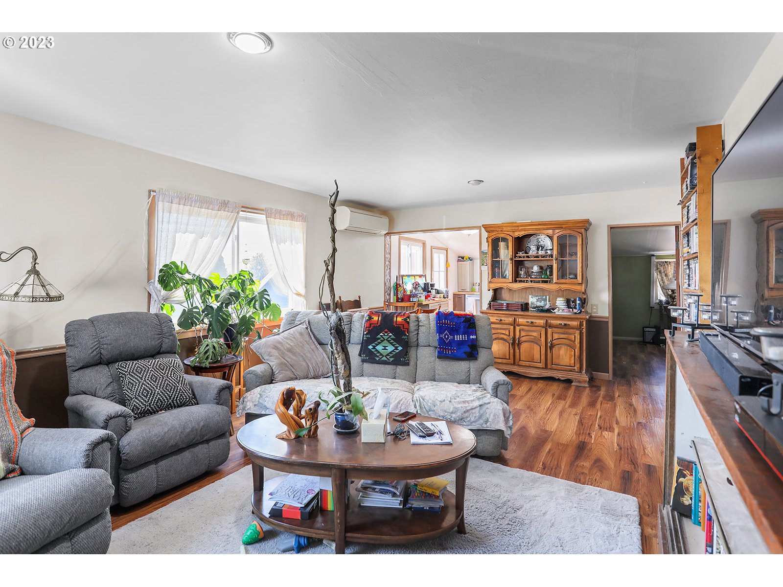 695 Main Street Dufur, OR 97021 - Photo 9 of 42 a living room with furniture and a wooden floor