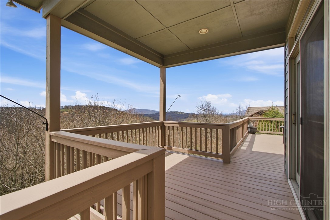 880 Algonquin Drive Boone, NC 28607 - Photo 14 of 50 a view of a balcony with wooden floor