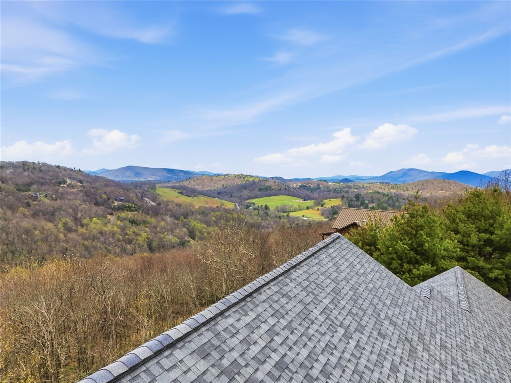 880 Algonquin Drive Boone, NC 28607 - Photo 16 of 50 a view of a lake with a mountain