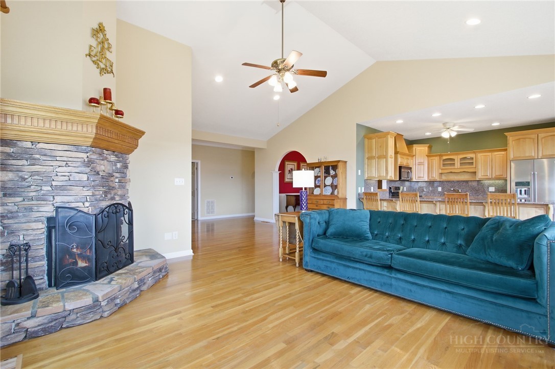 880 Algonquin Drive Boone, NC 28607 - Photo 28 of 50 a living room with furniture and a fireplace