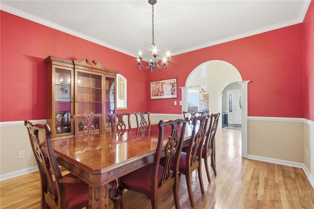 880 Algonquin Drive Boone, NC 28607 - Photo 30 of 50 a view of a dining room with furniture and chandelier