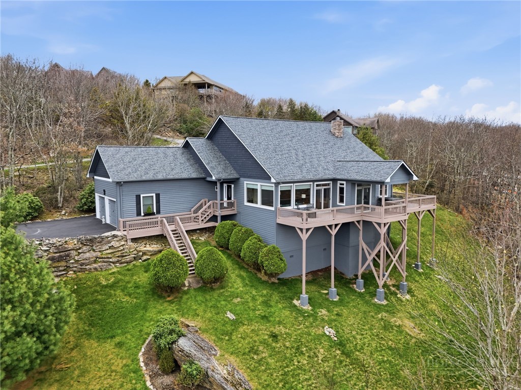 880 Algonquin Drive Boone, NC 28607 - Photo 3 of 50 a aerial view of a house with a big yard plants and large trees