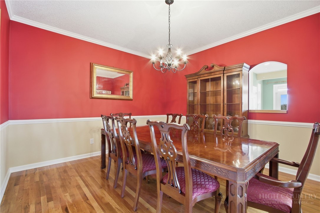 880 Algonquin Drive Boone, NC 28607 - Photo 31 of 50 a view of a dining room with furniture and chandelier