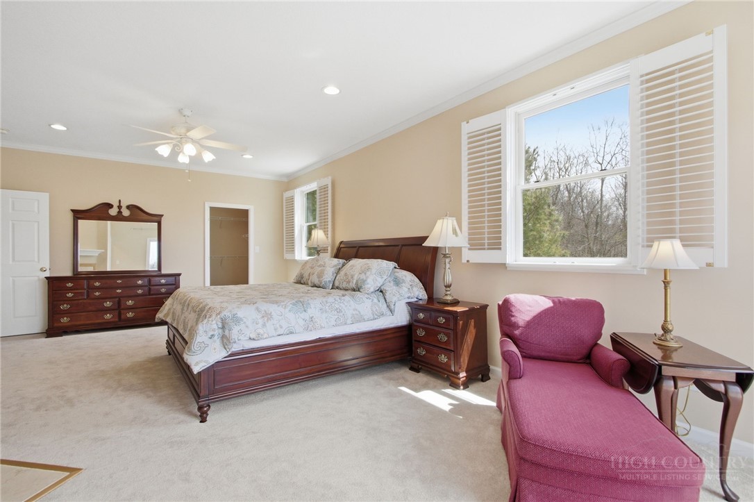 880 Algonquin Drive Boone, NC 28607 - Photo 35 of 50 a bed room with a bed and a couch