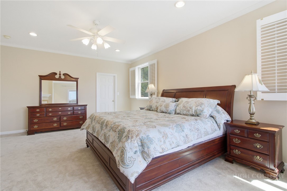 880 Algonquin Drive Boone, NC 28607 - Photo 36 of 50 a bedroom with a bed and a dresser