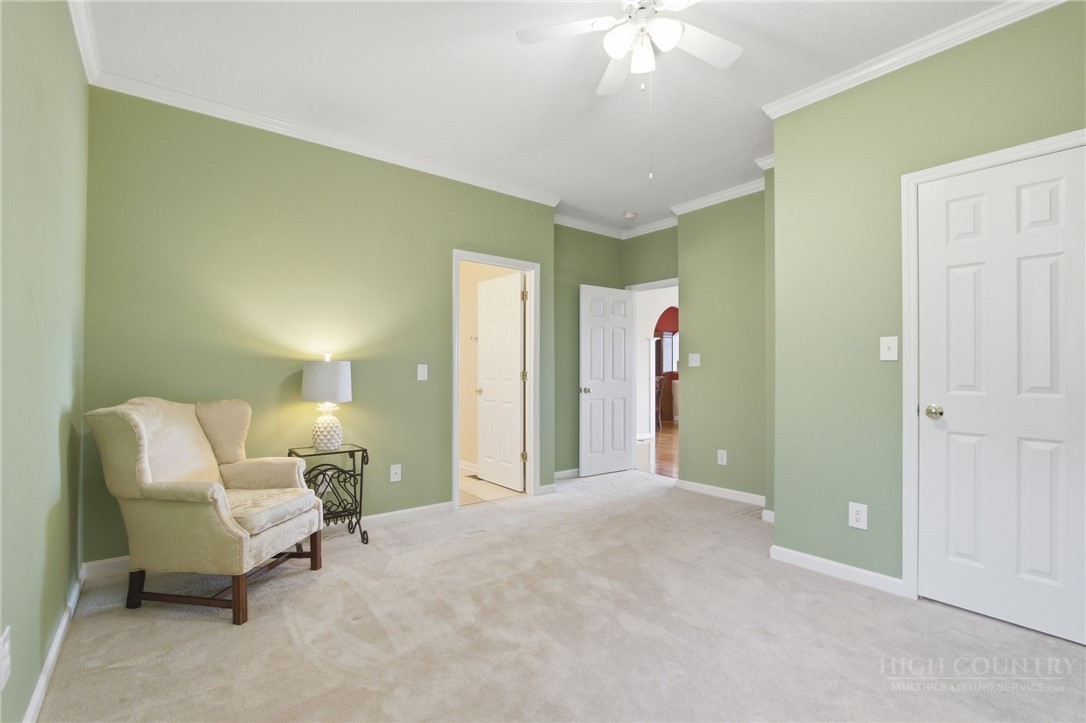 880 Algonquin Drive Boone, NC 28607 - Photo 42 of 50 a living room with furniture and a chandelier