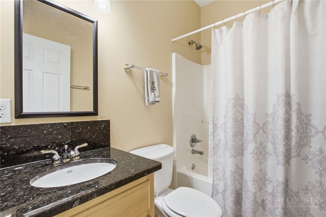 880 Algonquin Drive Boone, NC 28607 - Photo 43 of 50 a bathroom with a granite countertop sink toilet and shower