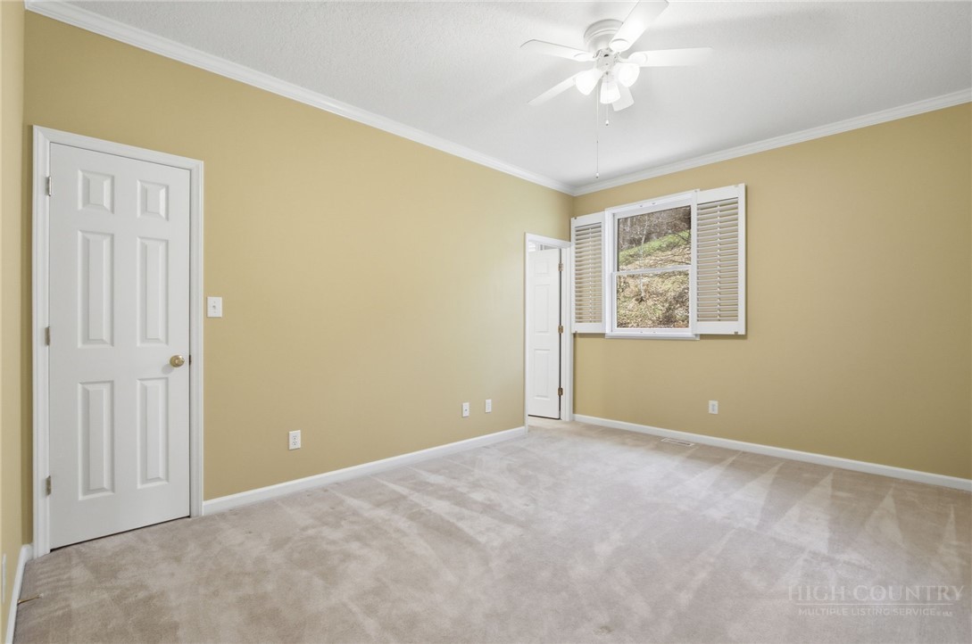 880 Algonquin Drive Boone, NC 28607 - Photo 44 of 50 a view of an empty room with a window