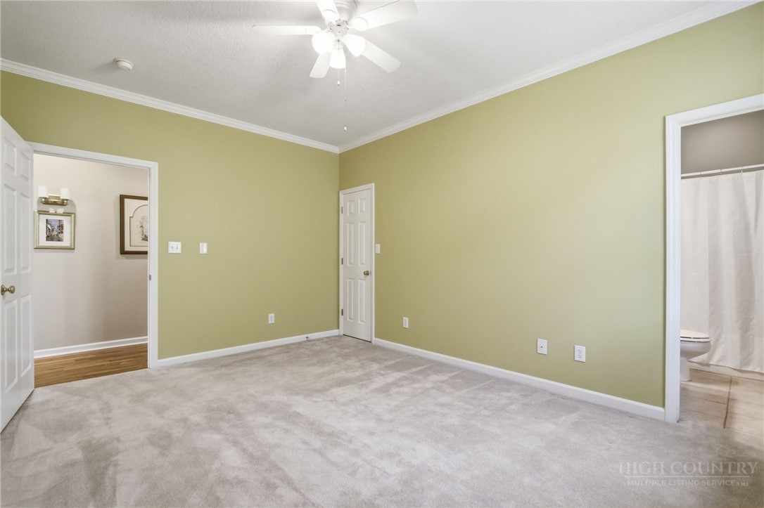 880 Algonquin Drive Boone, NC 28607 - Photo 45 of 50 a view of an empty room with chandelier fan
