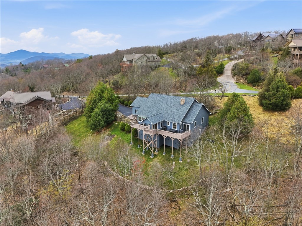 880 Algonquin Drive Boone, NC 28607 - Photo 5 of 50 a view of a lake with a mountain in the background
