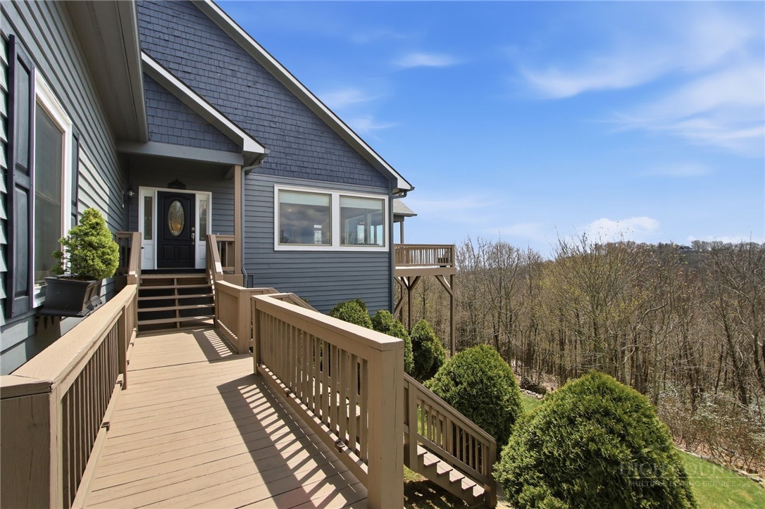 880 Algonquin Drive Boone, NC 28607 - Photo 9 of 50 a view of a house with wooden deck and furniture