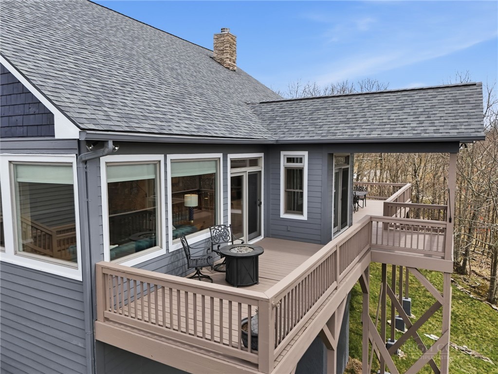 880 Algonquin Drive Boone, NC 28607 - Photo 10 of 50 a view of a house with a wooden deck and furniture