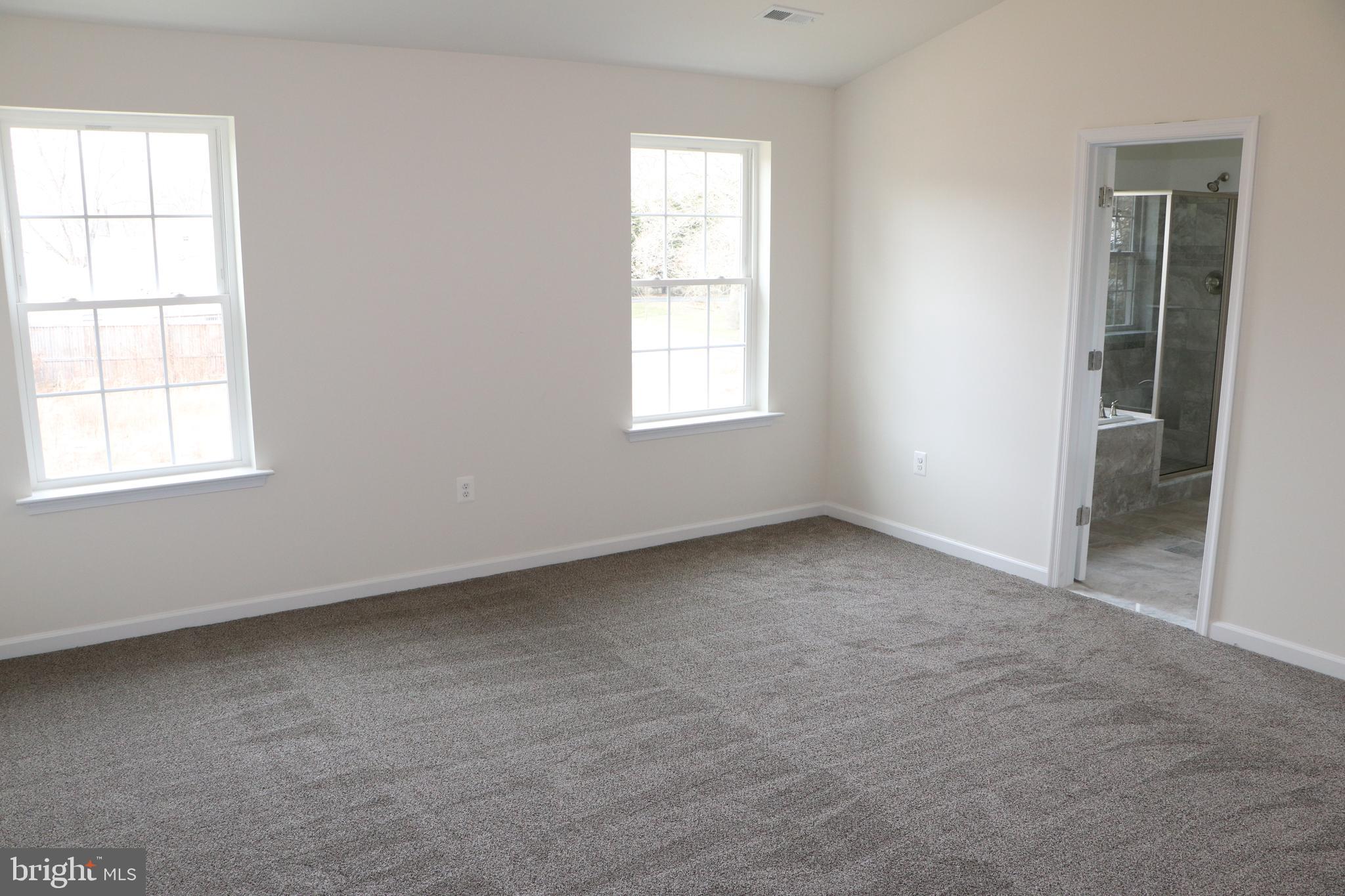 8008 Quarterfield Road Severn, MD 21144 - Photo 29 of 32 MASTER BEDROOM ,CATHEDRAL CEILING & NATURAL LIGHT