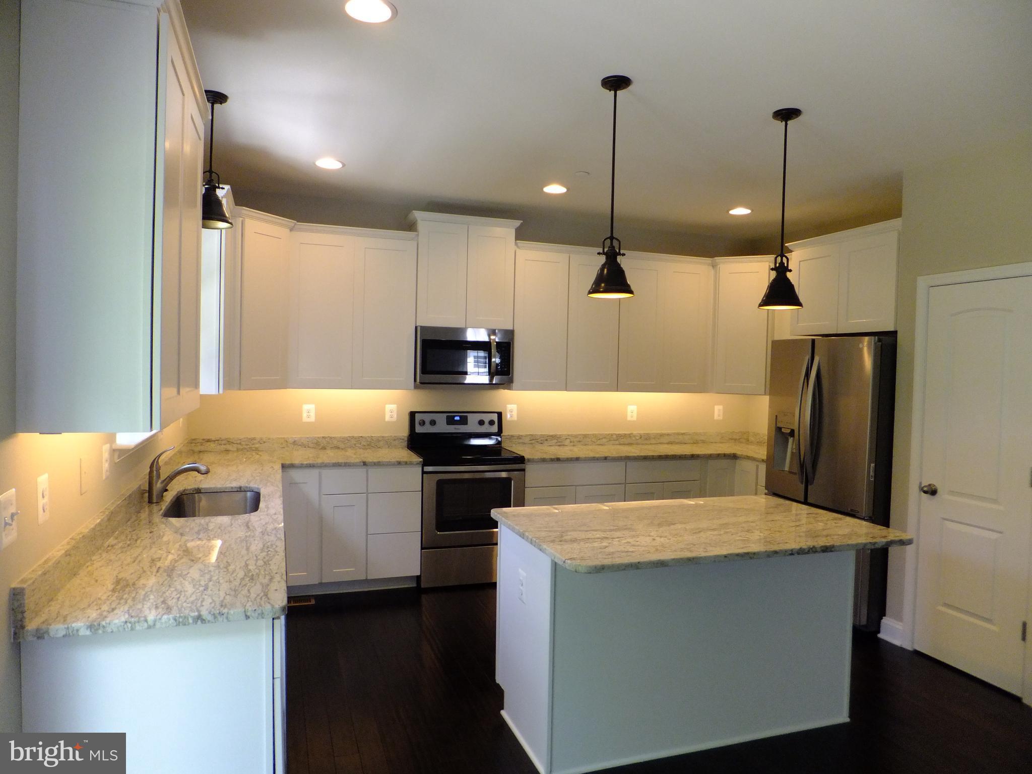 8008 Quarterfield Road Severn, MD 21144 - Photo 9 of 32 KITCHEN W/ ISLAND , SS APPLIANCES