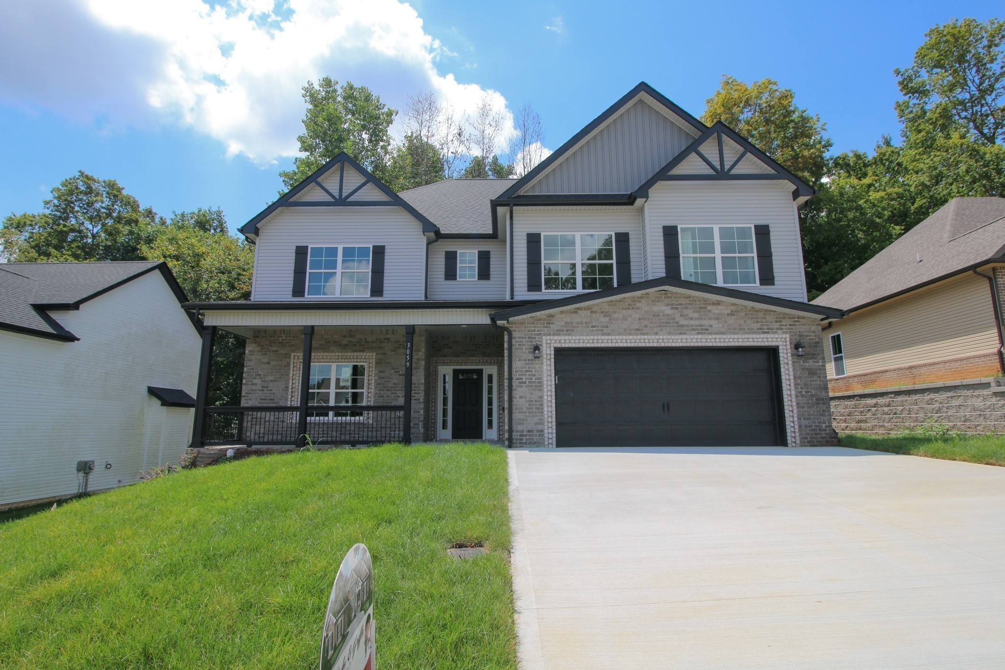 288 Timber Springs Clarksville, TN 37042 - Photo 1 of 25 a front view of a house with a yard and garage