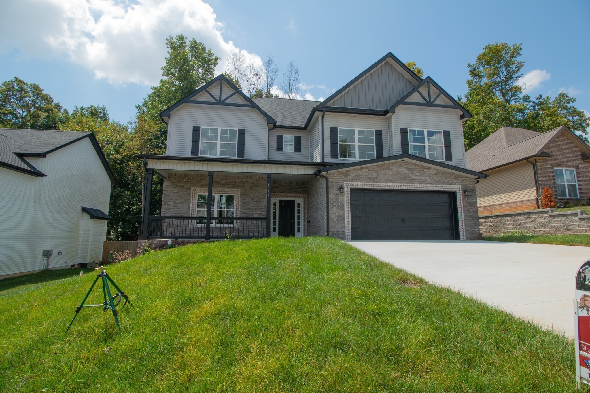 288 Timber Springs Clarksville, TN 37042 - Photo 2 of 25 a front view of a house with a yard and garage