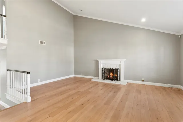 a view of an empty room with a fireplace