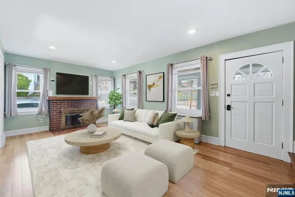 a kitchen with granite countertop a stove and a microwave
