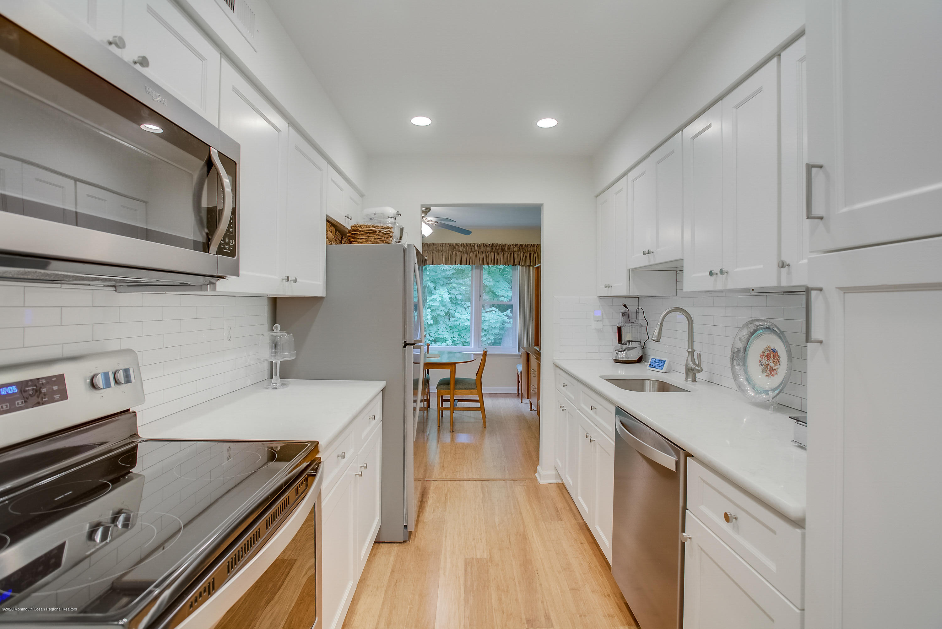 200 Portland Road, Unit E6 Highlands, NJ 07732 - Photo 1 of 30 a kitchen with a stove a sink a refrigerator and cabinets