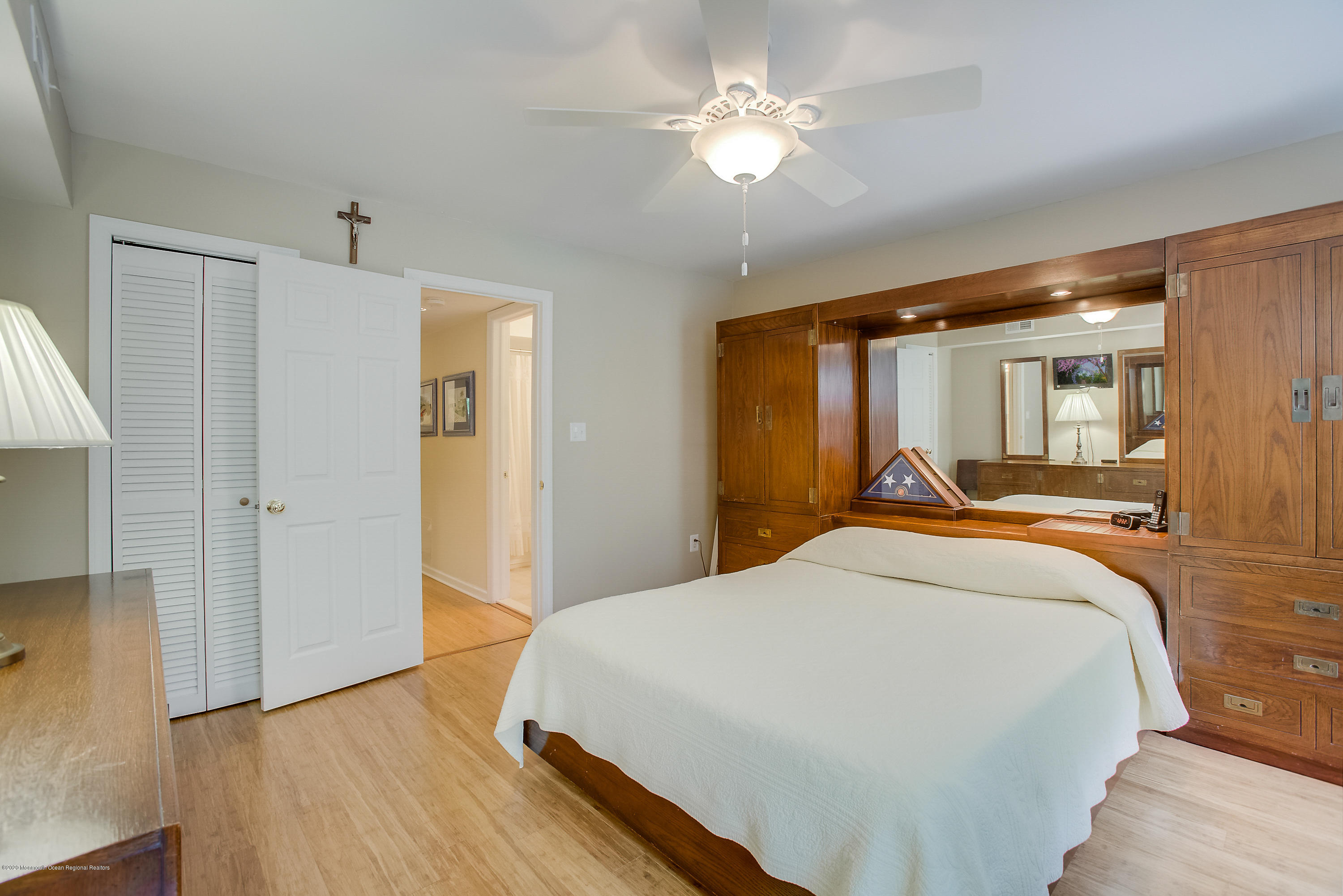 200 Portland Road, Unit E6 Highlands, NJ 07732 - Photo 17 of 30 a spacious bedroom with a bed and a chandelier