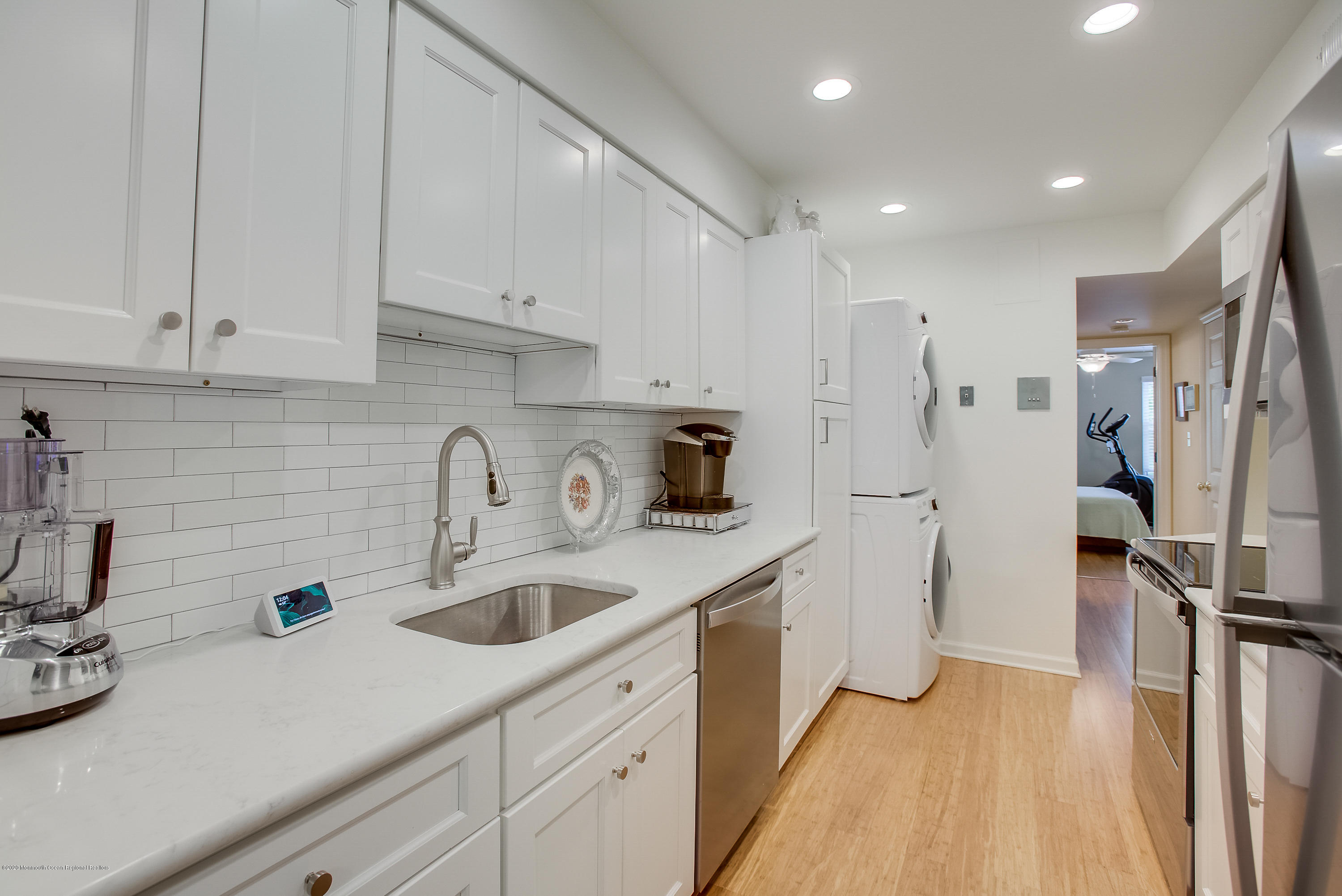 200 Portland Road, Unit E6 Highlands, NJ 07732 - Photo 2 of 30 a kitchen with a sink a refrigerator and cabinets