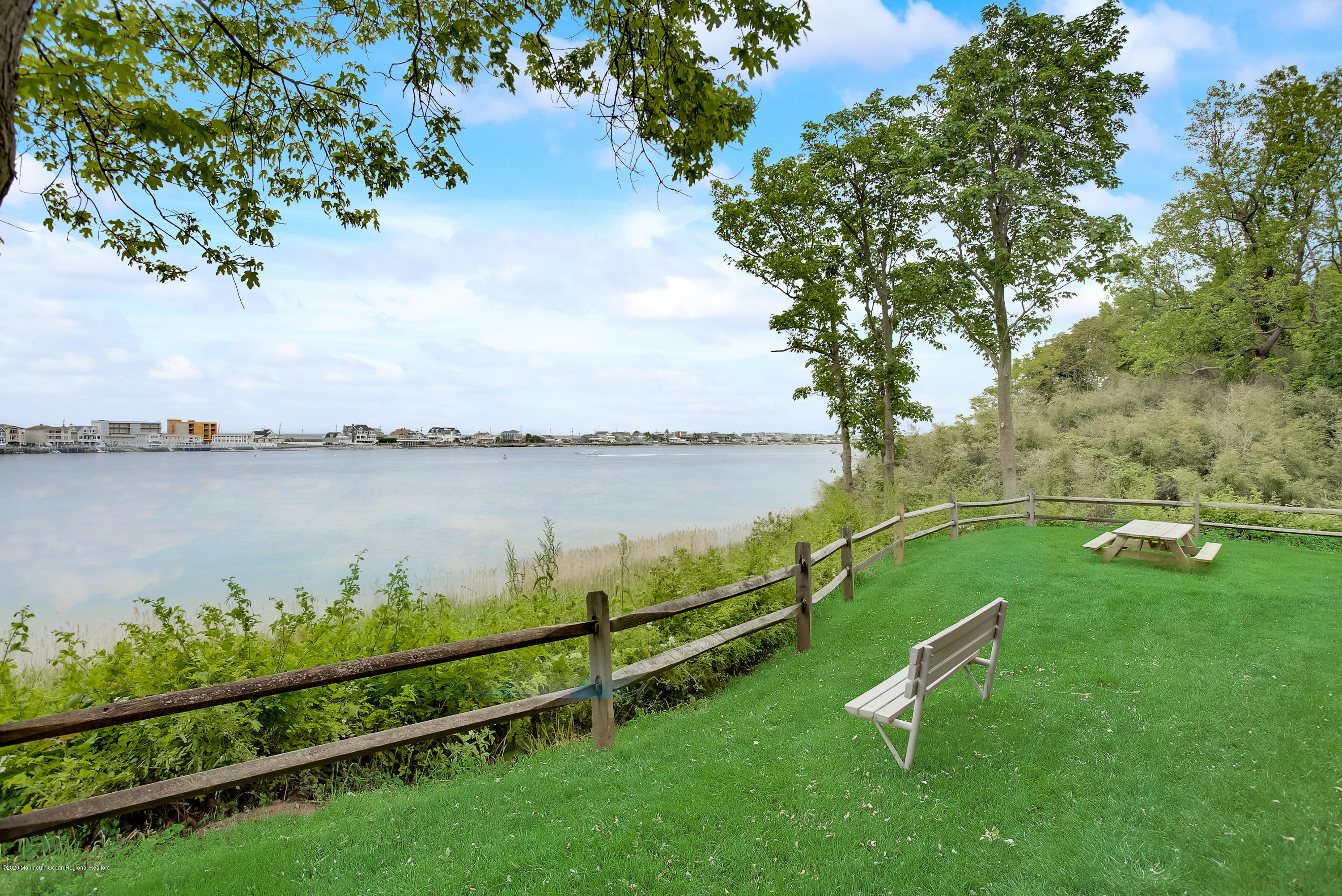 200 Portland Road, Unit E6 Highlands, NJ 07732 - Photo 29 of 30 a view of a lake with houses in the back