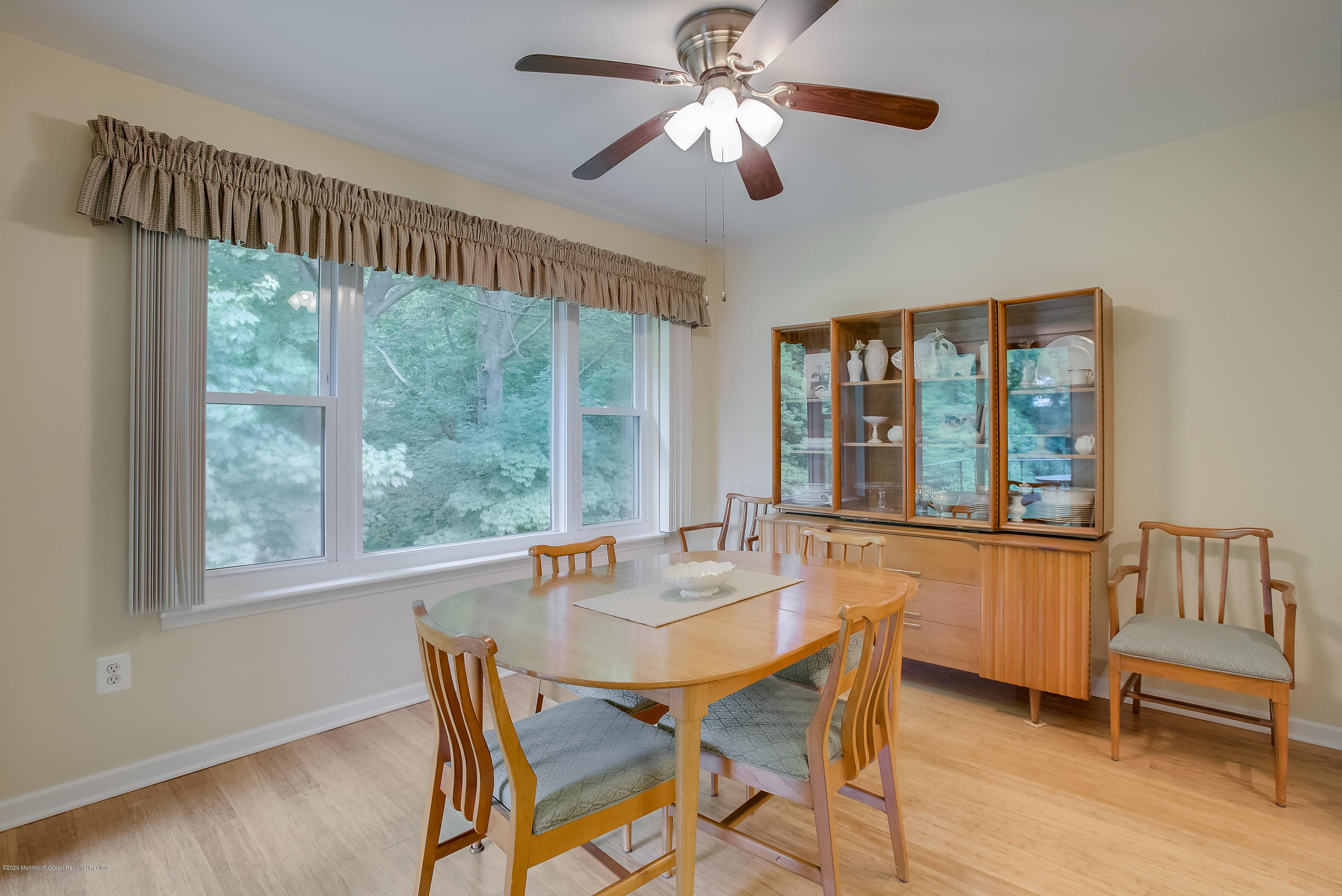 200 Portland Road, Unit E6 Highlands, NJ 07732 - Photo 6 of 30 a dining room with furniture a chandelier and wooden floor