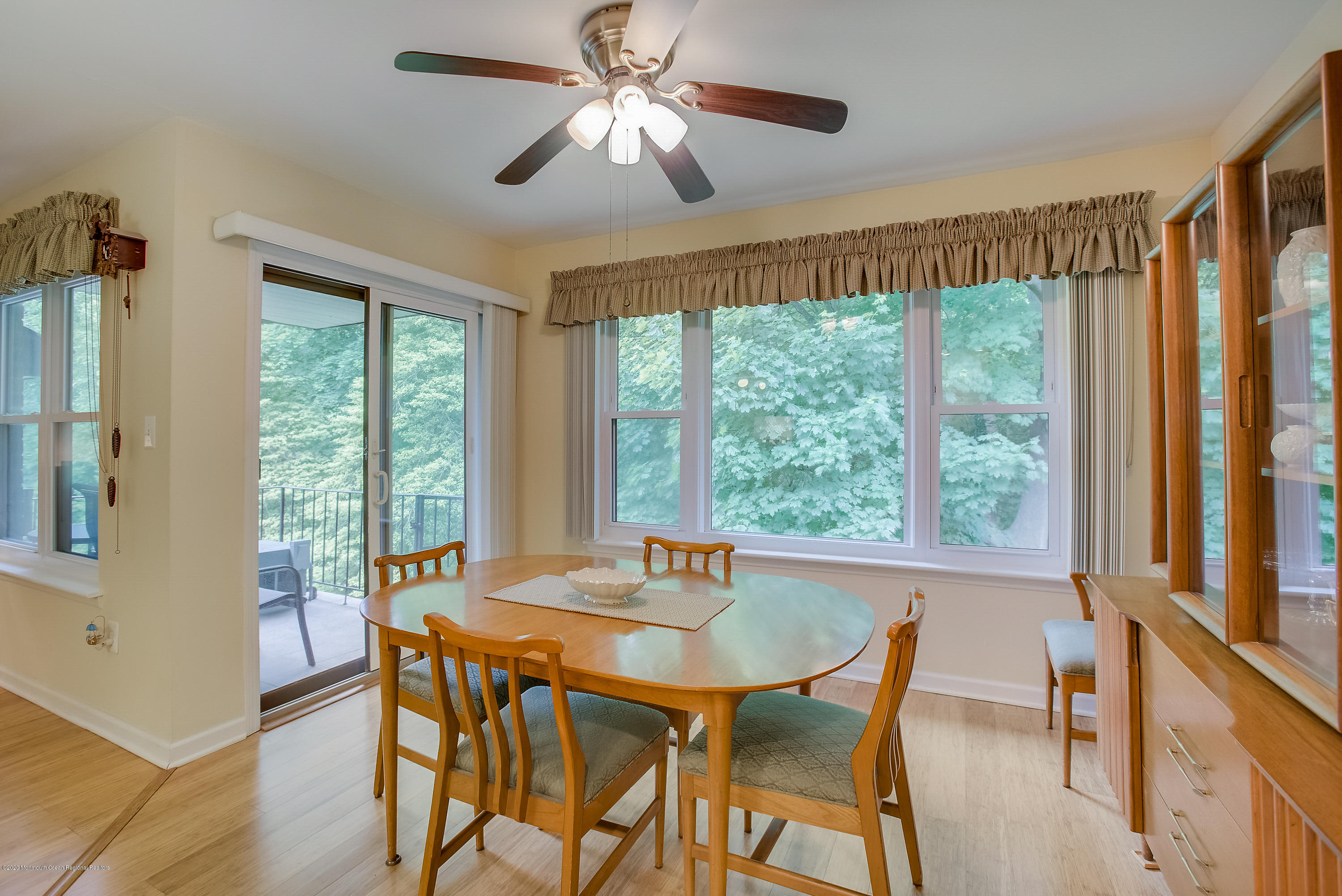 200 Portland Road, Unit E6 Highlands, NJ 07732 - Photo 7 of 30 a dining room with furniture window and wooden floor