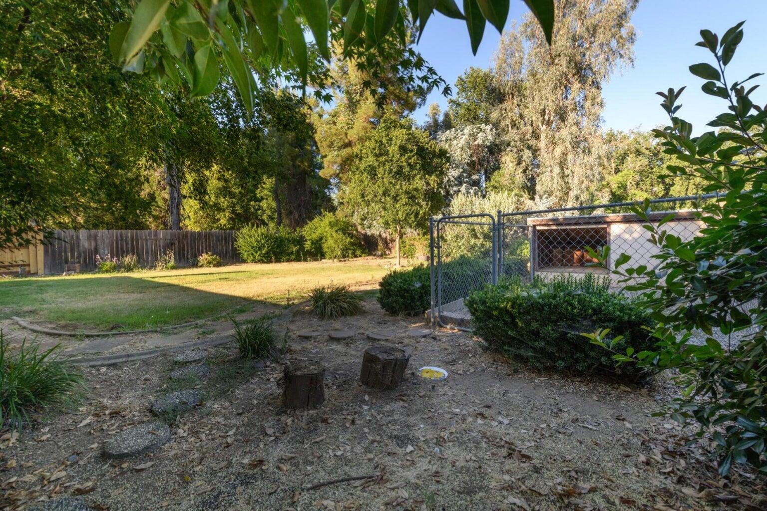 6781 Reflection Street Redding, CA 96001 - Photo 3 of 13 a view of a park with large trees