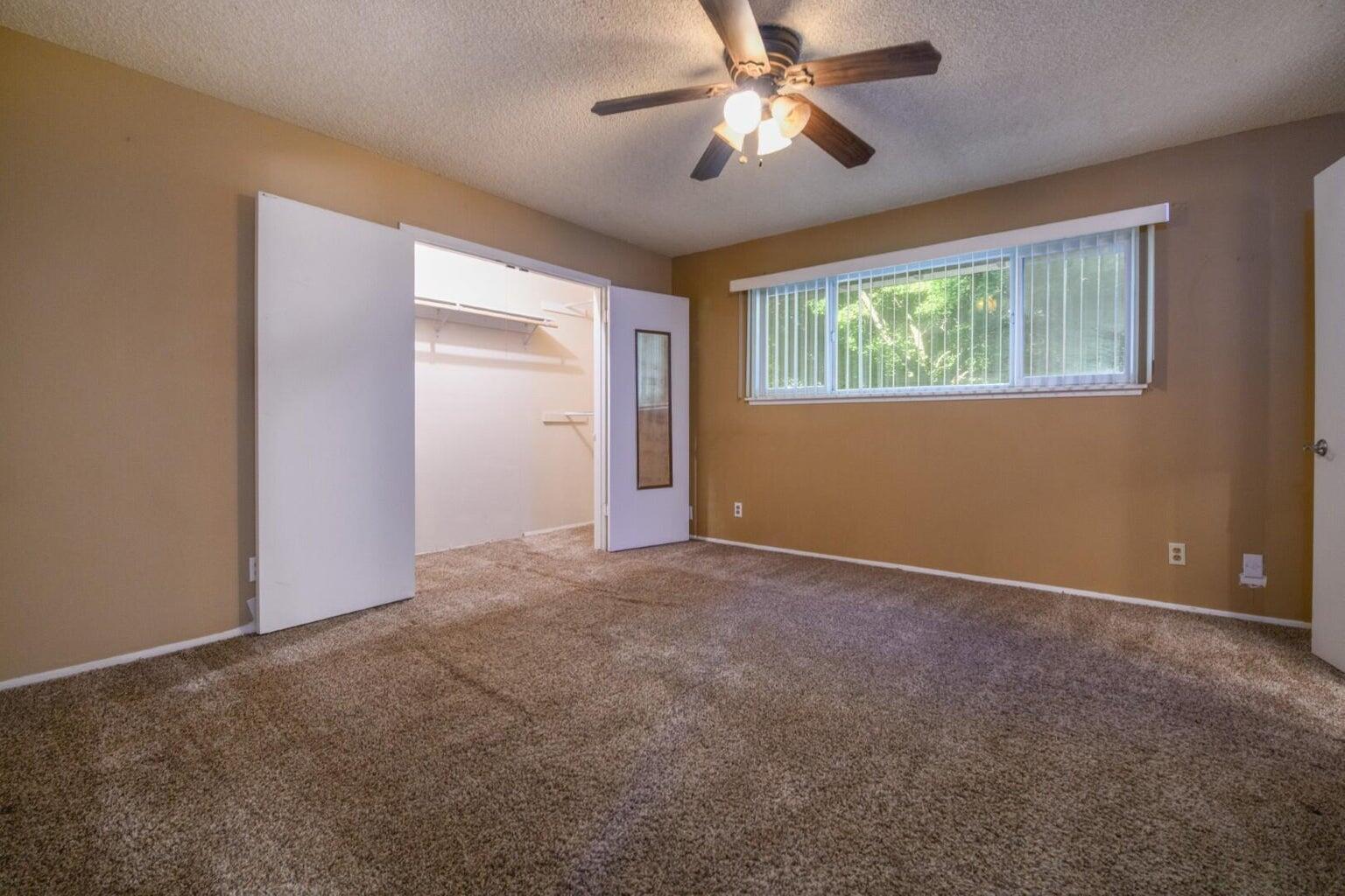 6781 Reflection Street Redding, CA 96001 - Photo 6 of 13 a view of an empty room with a window
