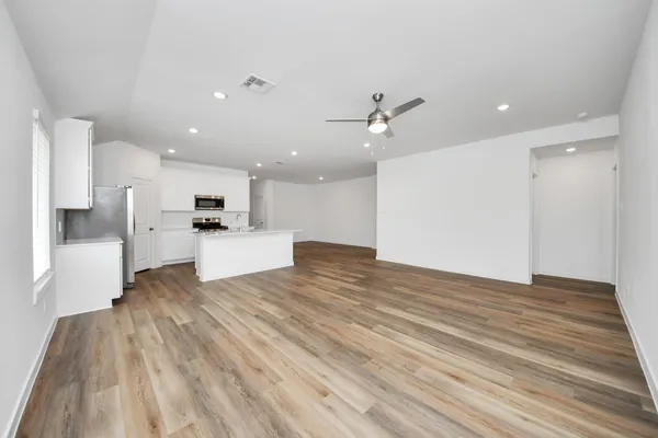 a view of kitchen with a sink wooden floor and kitchen