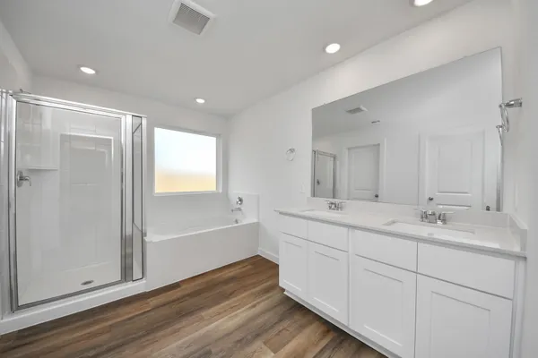 a bathroom with a bathtub and a shower