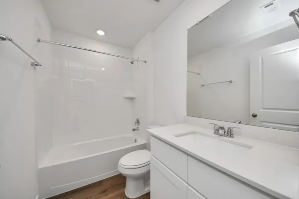 a bathroom with a sink a toilet and a bathtub