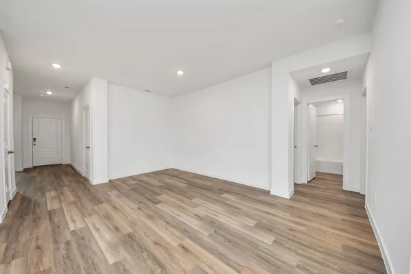 a view of livingroom with hardwood floor and hallway