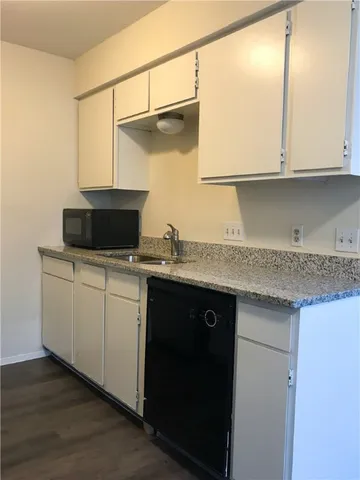 a kitchen with a sink and cabinets