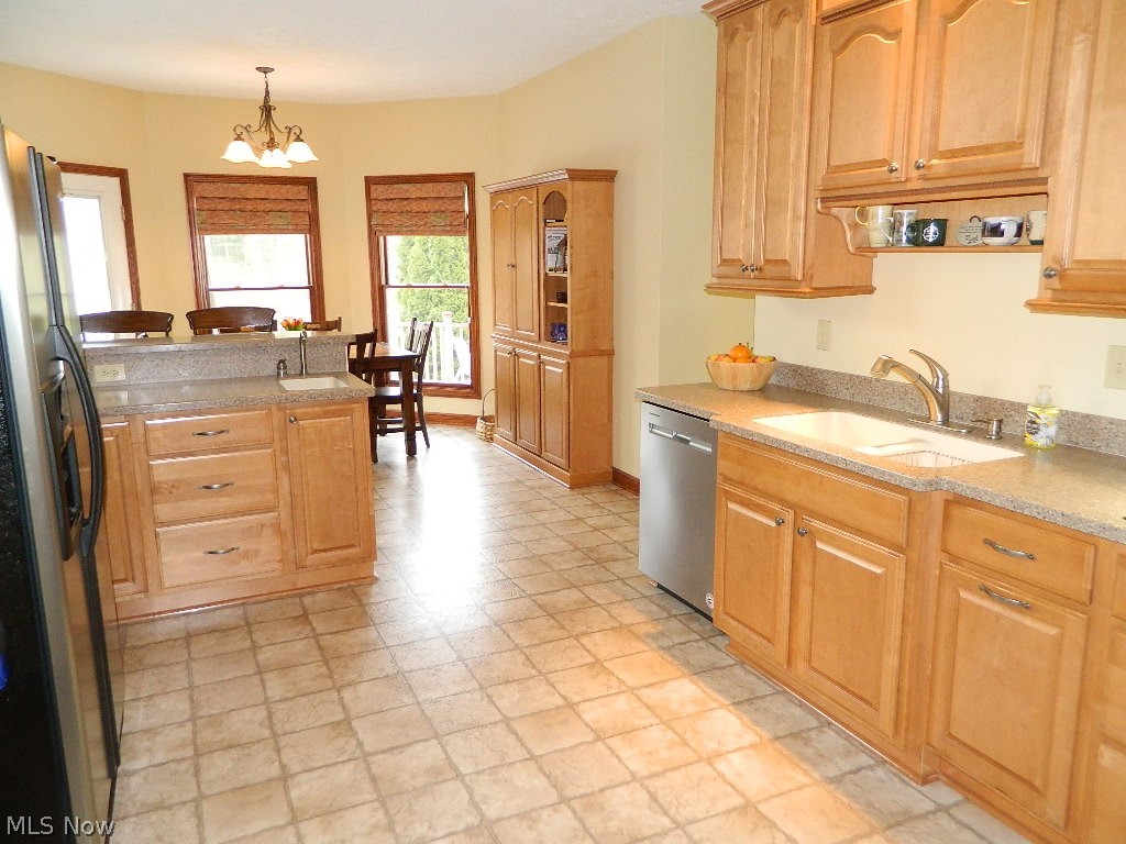 12395 Falcon Ridge Road Chesterland, OH 44026 - Photo 8 of 35 Expansive Dine In Kitchen with Separate Prep Area, All Appliances, and Access to the Back Yard Entertainment Center!