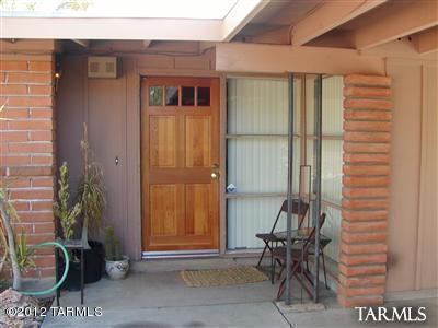 2825 North Indian Ruins Road Tucson, AZ 85715 - Photo 3 of 3 a porch with a table and chairs