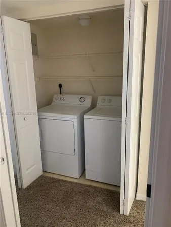 a utility room with a washer and dryer