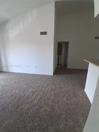 an empty room with an entryway