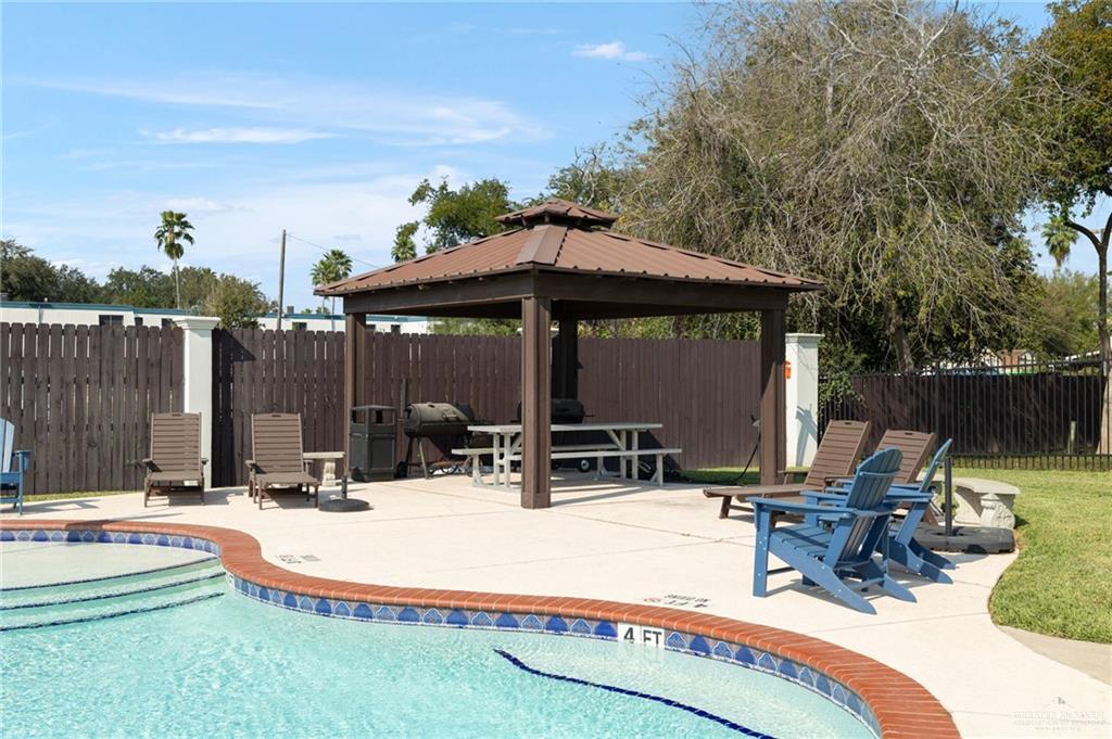 605 Ithaca Avenue McAllen, TX 78501 - Photo 21 of 23 a view of backyard with seating space and trees in the background