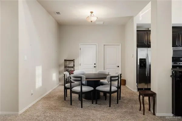 a view of a dining room with furniture