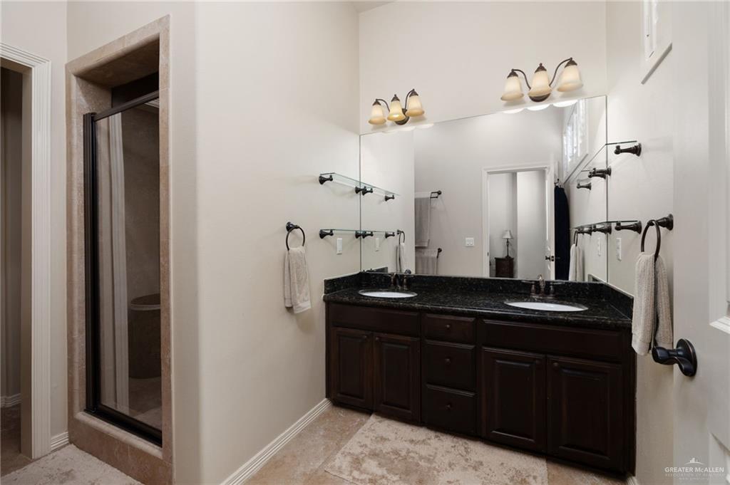 605 Ithaca Avenue McAllen, TX 78501 - Photo 9 of 23 a bathroom with a sink and a mirror