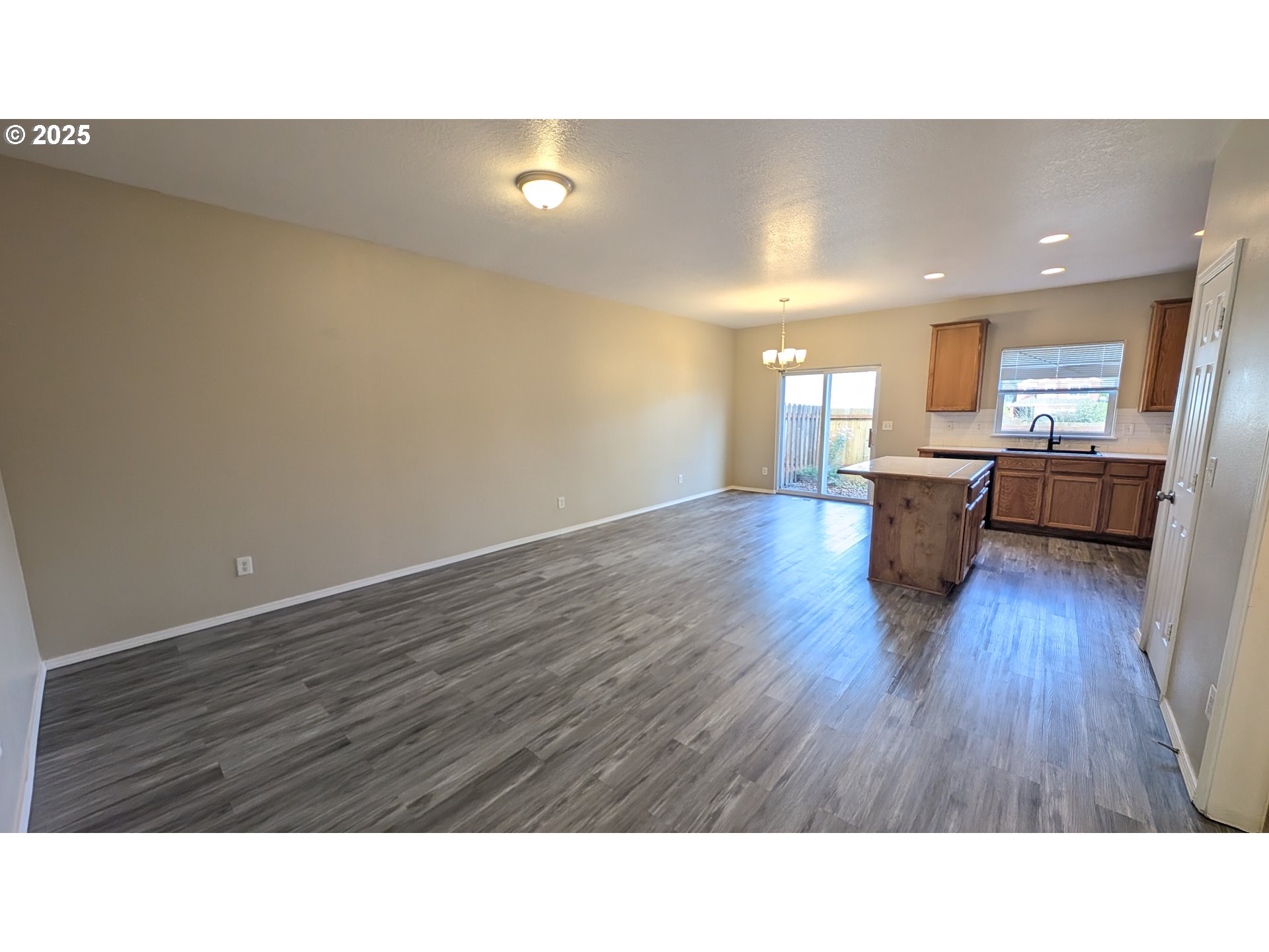 18541 Southwest Takena Court Beaverton, OR 97003 - Photo 2 of 24 a open kitchen with cabinets and wooden floor