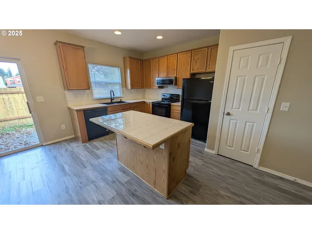 a kitchen with appliances and cabinets